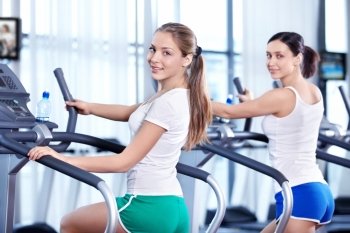 Young attractive woman in the fitness club
