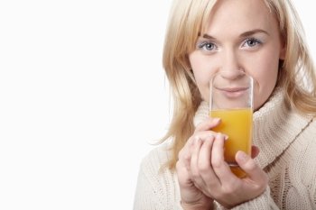 Attractive girl with a glass of juice on a white background