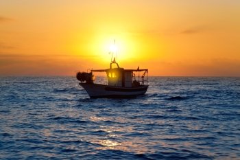 fishing boat in sunrise at Mediterranean sea traditional fishery