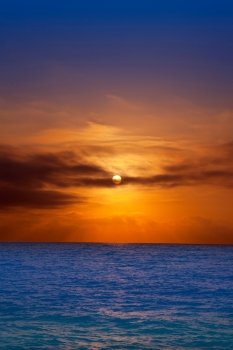 golden sunrise with sun and clouds over blue Mediterranean sea