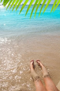 Children girl legs in beach sand shore at summer vacation