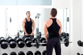 man with dumbbell weight training equipment on sport gym