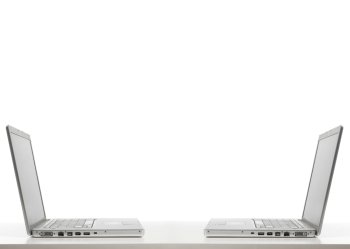 two laptops opposite each other isolated on white