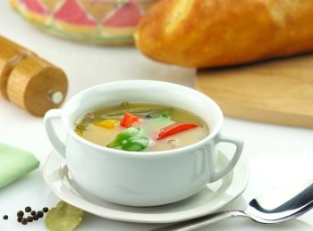 vegetable soup in a white soup cup