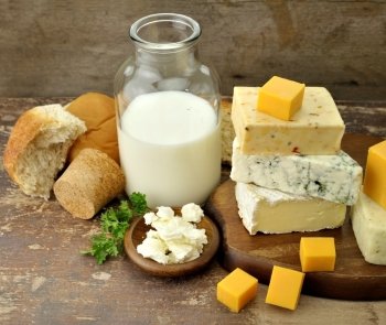 Dairy Products On Wooden Background