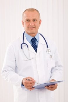 Professional senior doctor male with stethoscope portrait write document folders