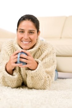 Winter portrait of happy woman with coffee cup wear pullover
