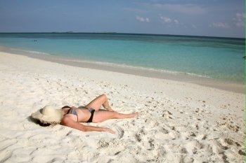 a woman on a dream beach. on vacation