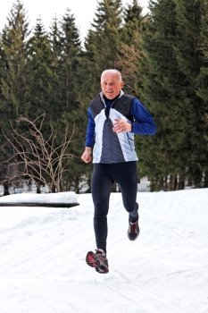 senior-country skiers in winter on snow when jogging