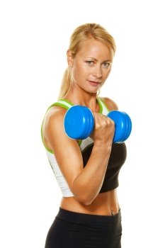 a young woman with dumbbells when training for strength and fitness