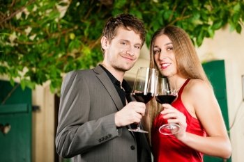 Couple at winetasting in a restaurant