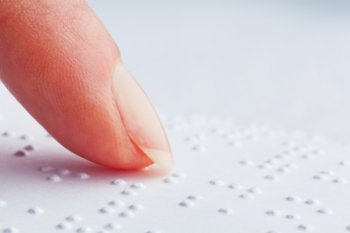 a book written in braille. braille for the blind.