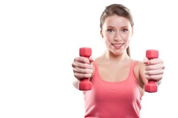 An isolated shot of a beautiful sporty caucasian woman lifting dumbbells