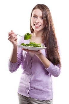 An isolated shot of a caucasian woman holding a plate of salad