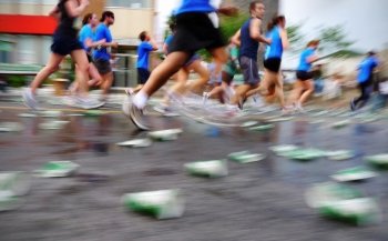 Blurring runners in a marathon running race.