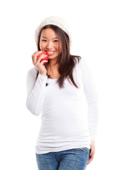 An isolated shot of an asian girl eating apple