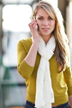 A beautiful caucasian woman talking on her phone