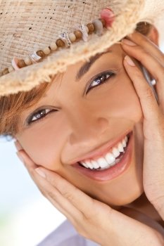 Beautiful Mixed Race Woman Laughing In Straw Coboy Hat