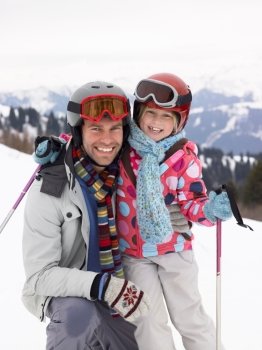 Young Father And Daughter On Ski Vacation