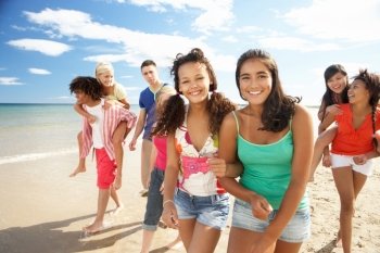 Teenagers walking on beach