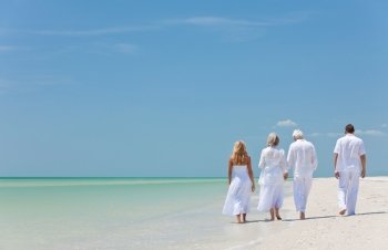 Four People, Two Seniors, Family Couples, Walking On Tropical Beach