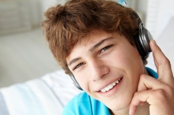 Teenage boy wearing headphones