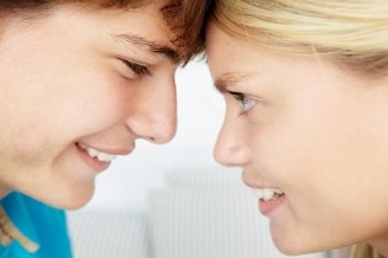 Teenage boy and girl close up profile