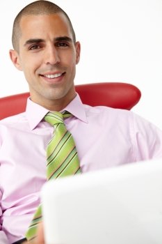 Young businessman using laptop