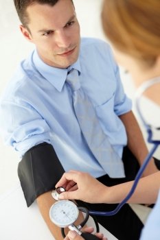 Young man having blood pressure taken