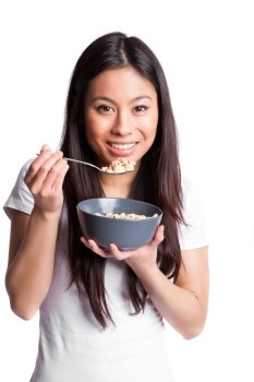 An isolated shot of an asian woman holding a bowl of cereal