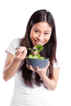 An isolated shot of an asian woman holding a bowl of salad