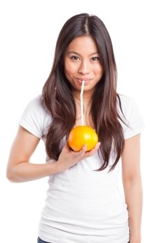 An isolated shot of a beautiful asian woman drinking orange juice