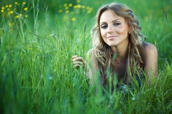 woman on the green grass happy and smile