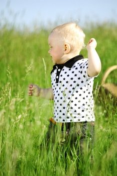 boy joy in green grass
