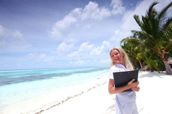 business woman on ocean coast on the background of a palm trees and sky and sea