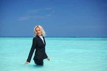 business woman stay in ocean waves