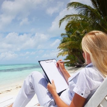 business woman with blank paper lying on a chaise lounge in the tropical ocean coast