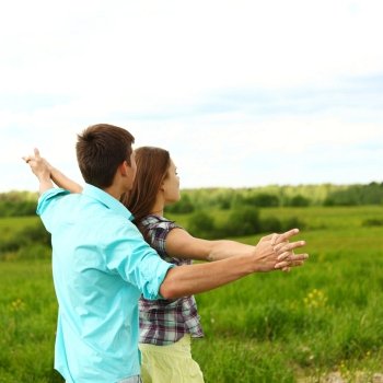 Couple standing in a field