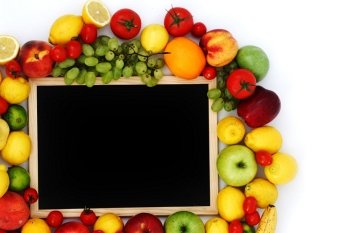 Board surrounded by fruit