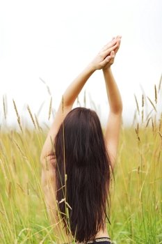 woman on grass field feel freedom