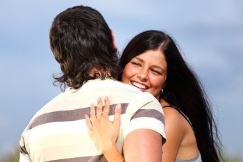 man and woman hug sky on background