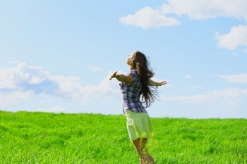 woman on summer green field feel freedom