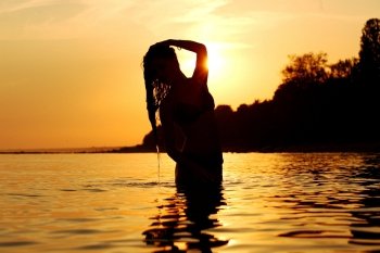 ocean woman in sunrise light