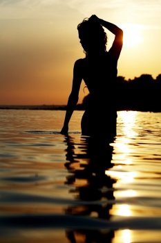 Silhouette of a woman at the beach