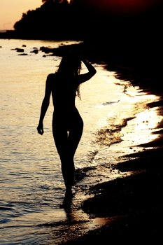 Silhouette of a woman at the beach
