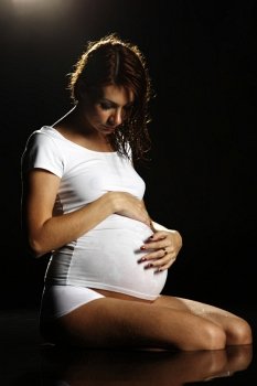 pregnant woman in water studio