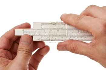slide rule in hand  isolated on a white background