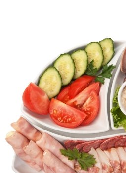 dish of assorted sausages and vegetables  isolated on white background