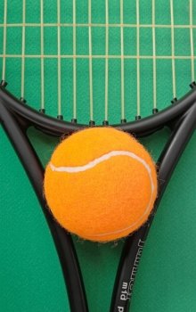 tennis racket and  ball on a green background