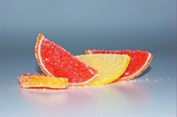 slices of orange, lemon and grapefruit  in sugar